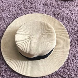 Weaved ecote hat with black bow.